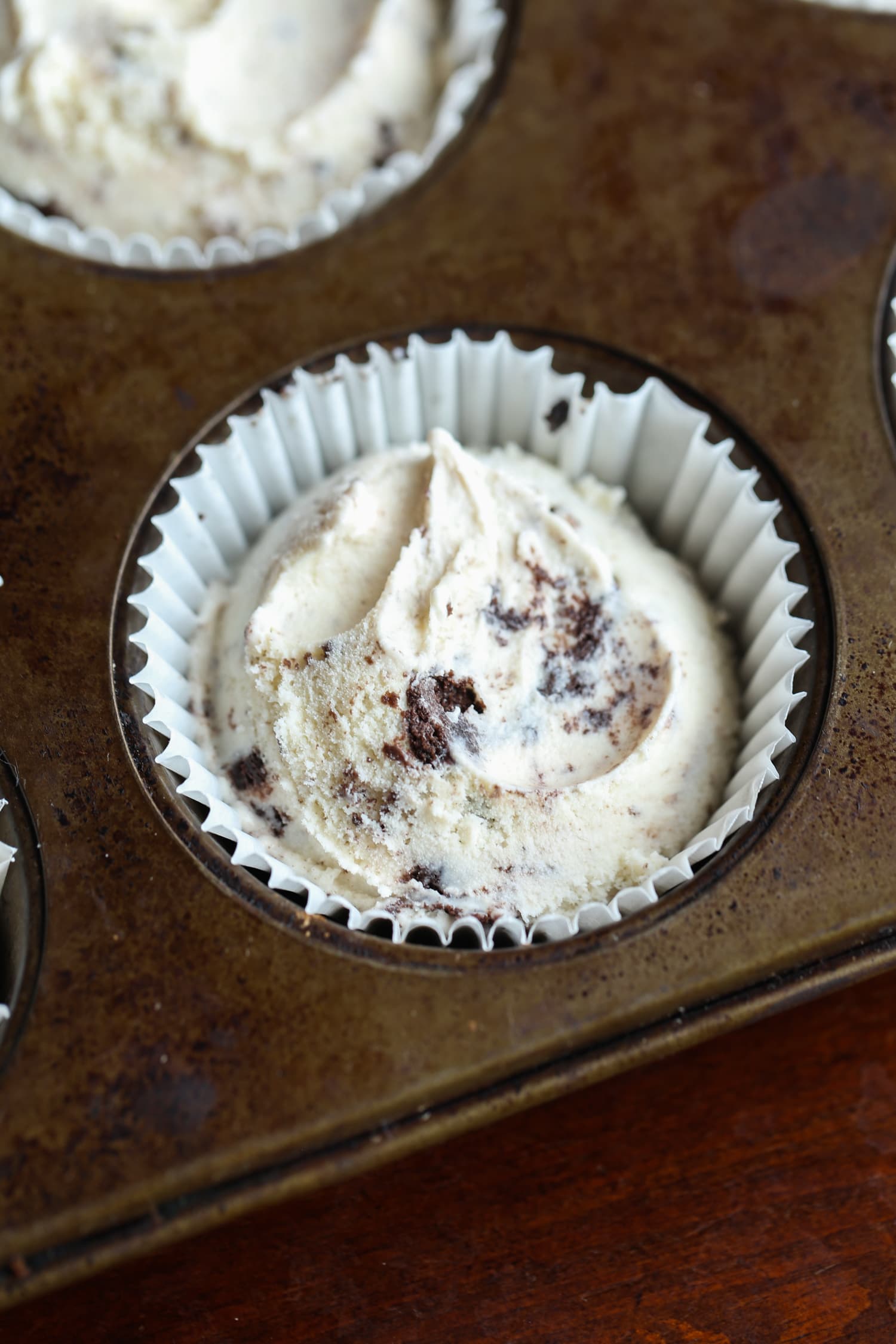 Cookies and cream ice cream in a cupcake liner and muffin tin