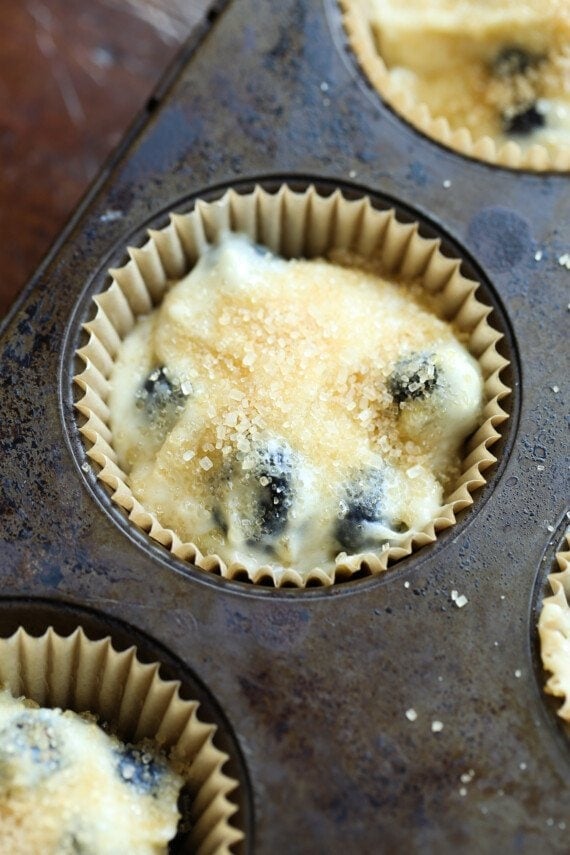 Muffin batter with brown sugar crumbs on top.
