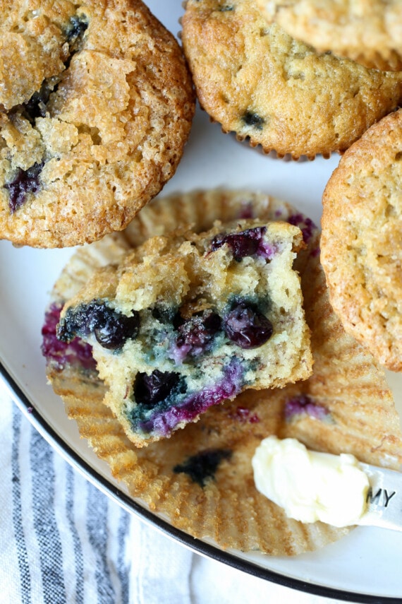 Half a muffin with the wrapper peeled off.