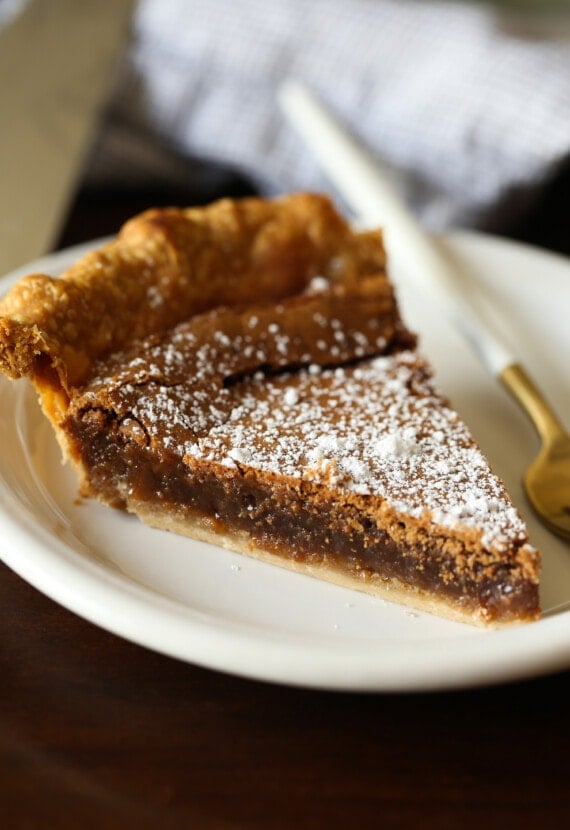 Slice of chocolate chess pie on a plate