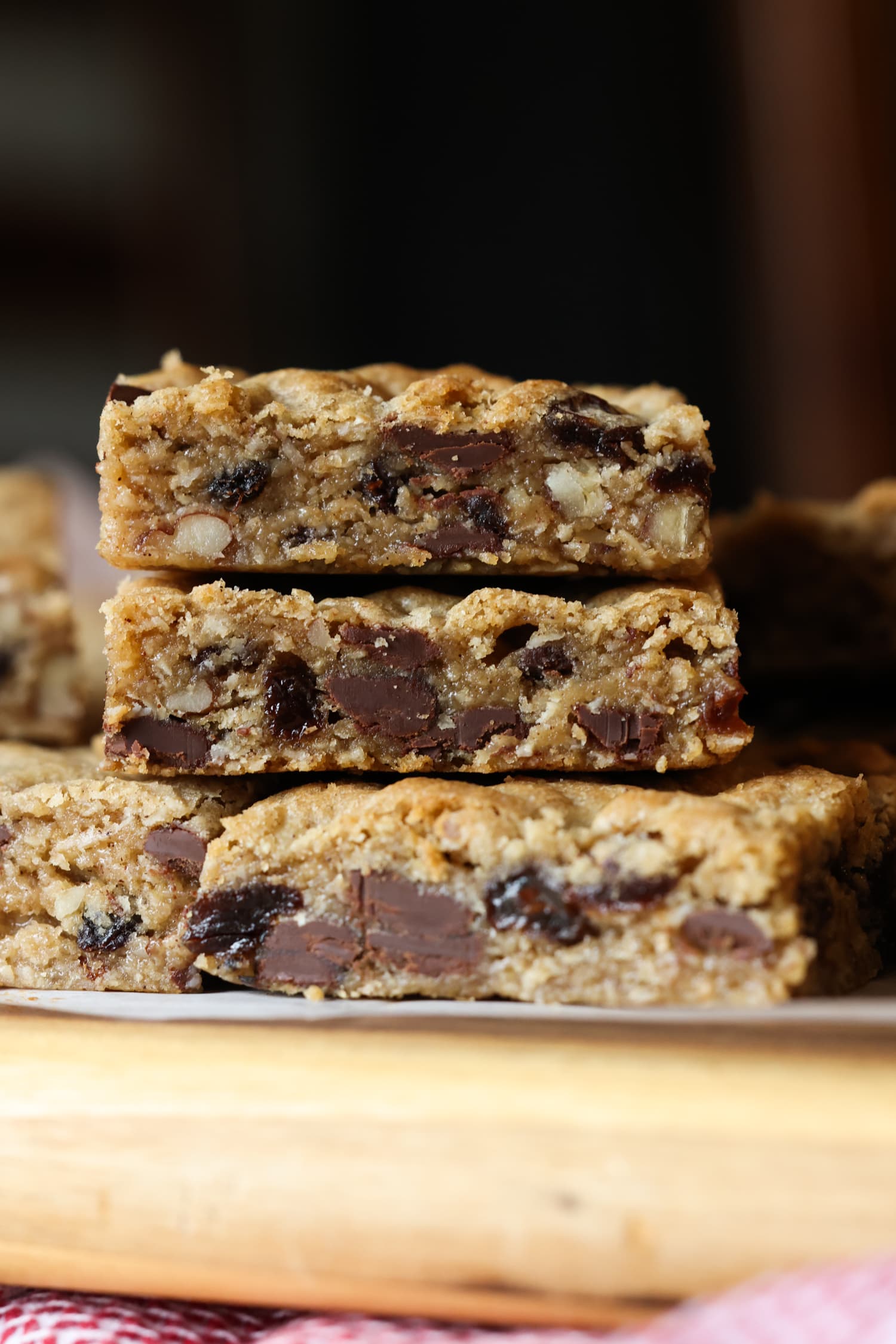 stacked oatmeal cookie bars with chocolate chips, raisins and walnuts