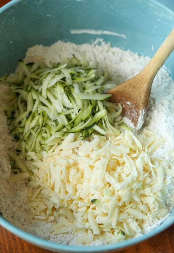 grated zucchini and cheese in a bowl
