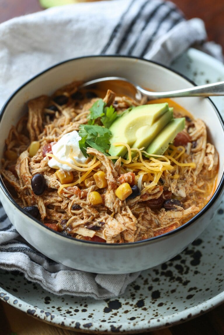 Chicken Enchilada soup in a bowl with a spoon