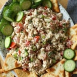 Feta Dip on a platter with pita chips and cucumbers