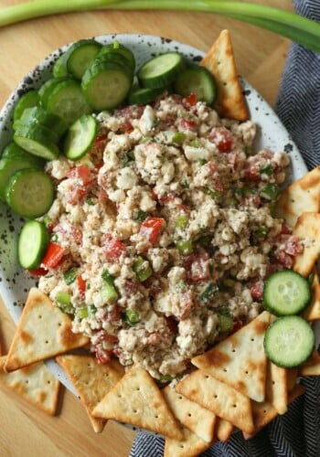 Feta Dip on a platter with pita chips and cucumbers
