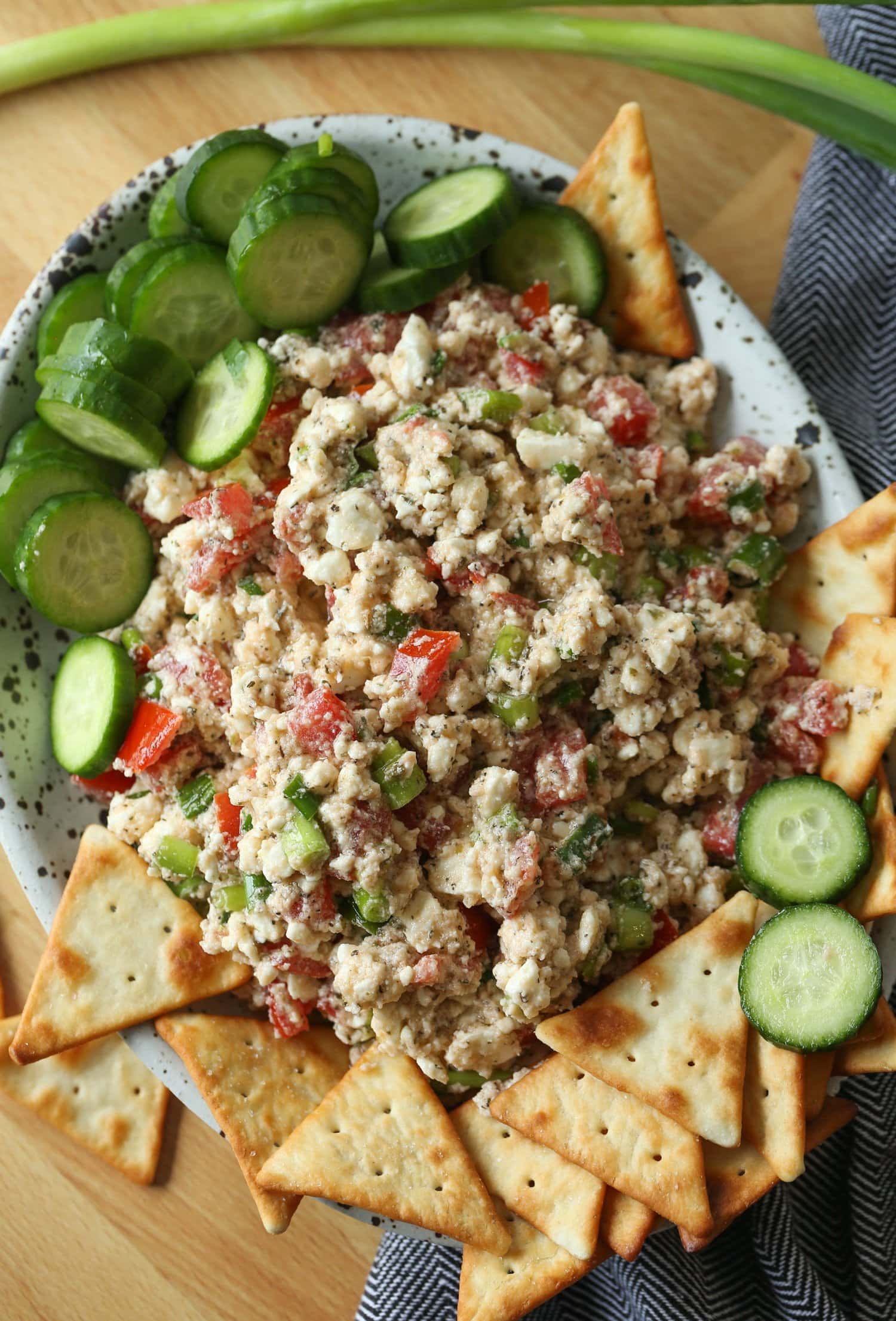 Feta Dip on a platter with pita chips and cucumbers