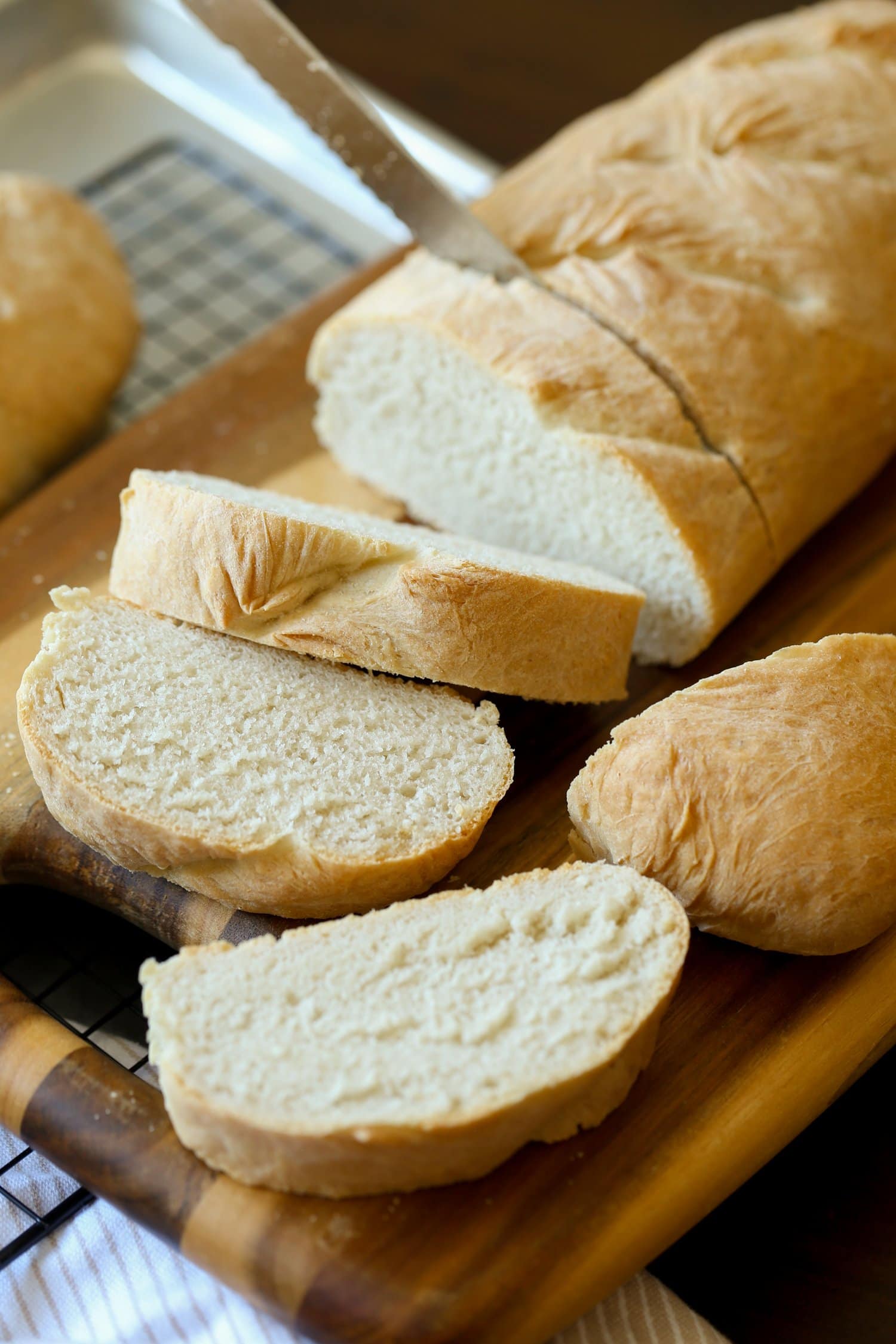 Slices of French bread on a cutting board.