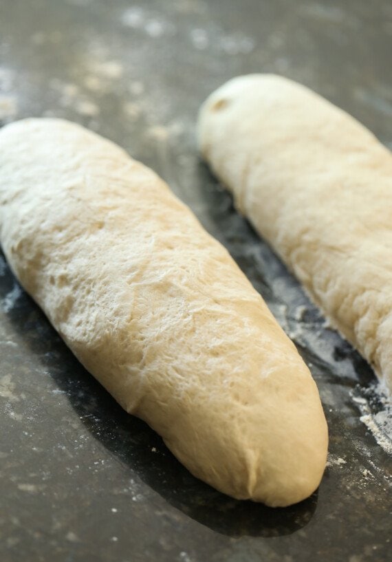 Dough shaped into two loaves of bread.