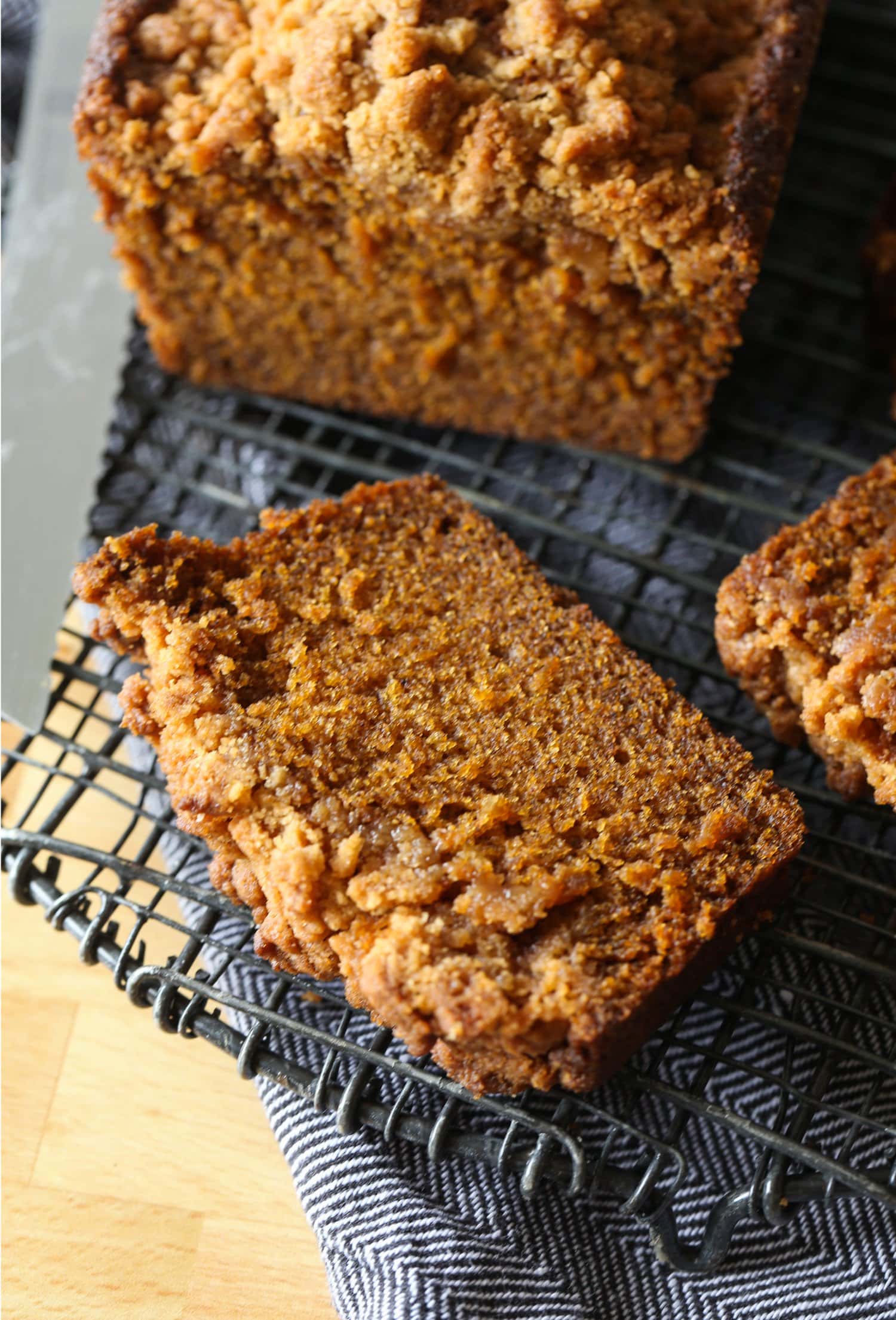 a slice of pumpkin bread on a wire rack