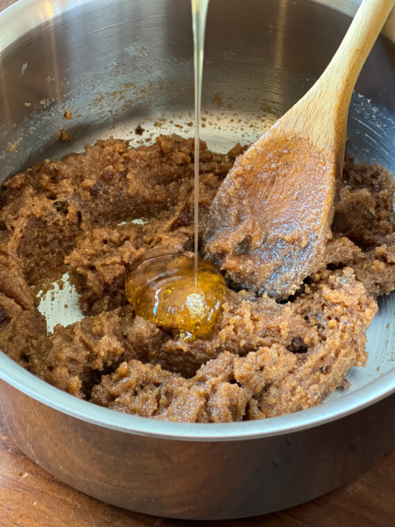 Adding honey to cookie dough