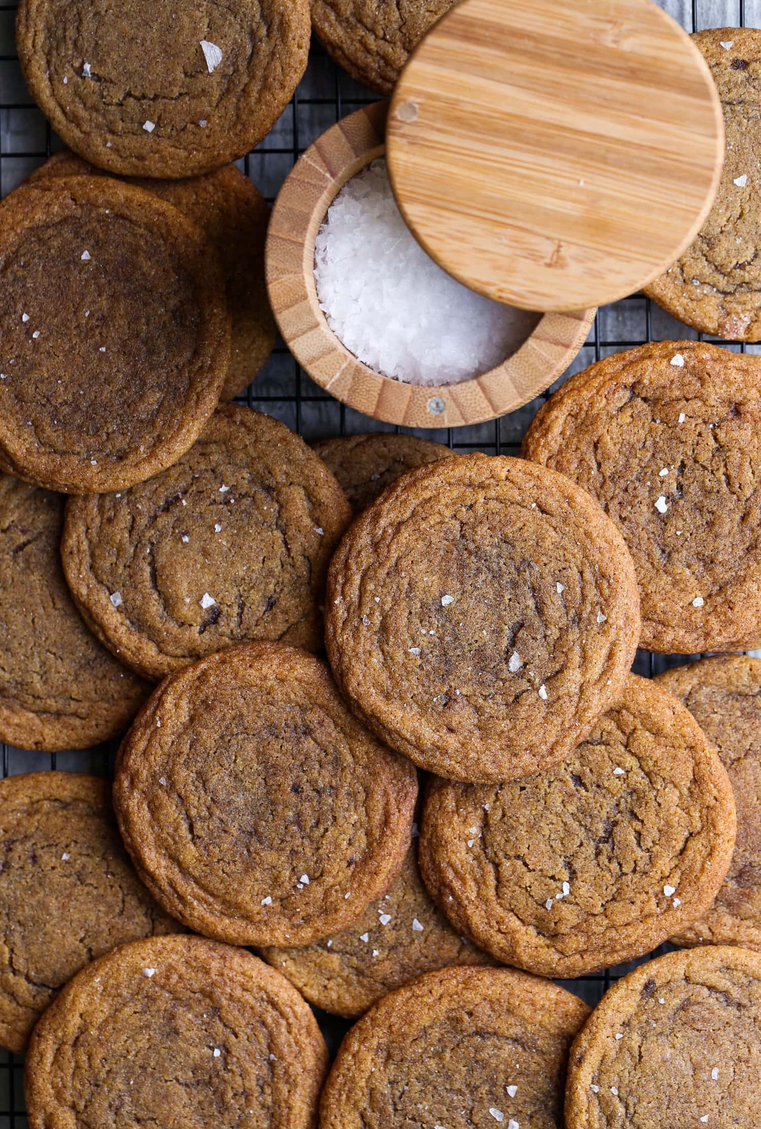 Chewy Pumpkin Cookies with flaked sea salt in a cooling rack