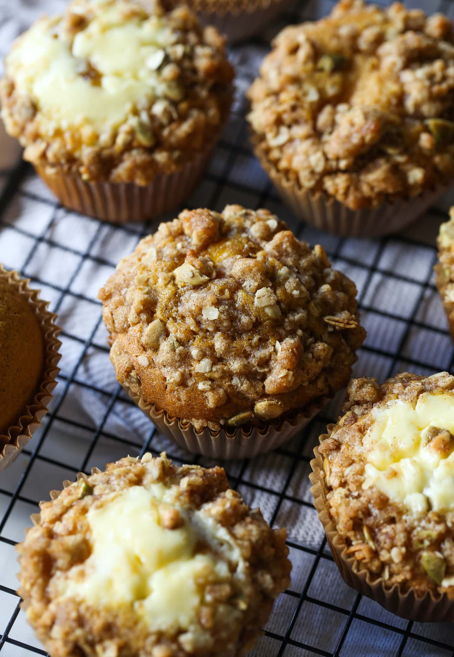 pumpkin muffin with crumble topping on a wire rack