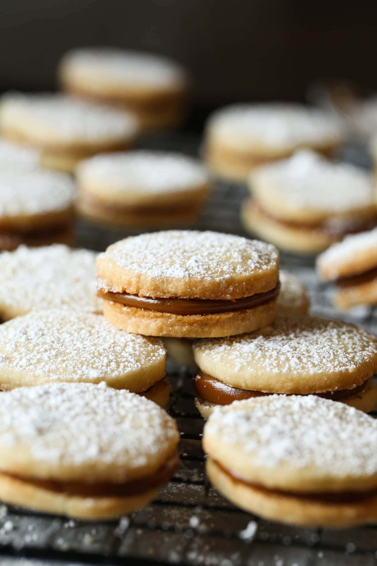 Alfajores cookies dusted with powdered sugar, filled with dulce de leche.