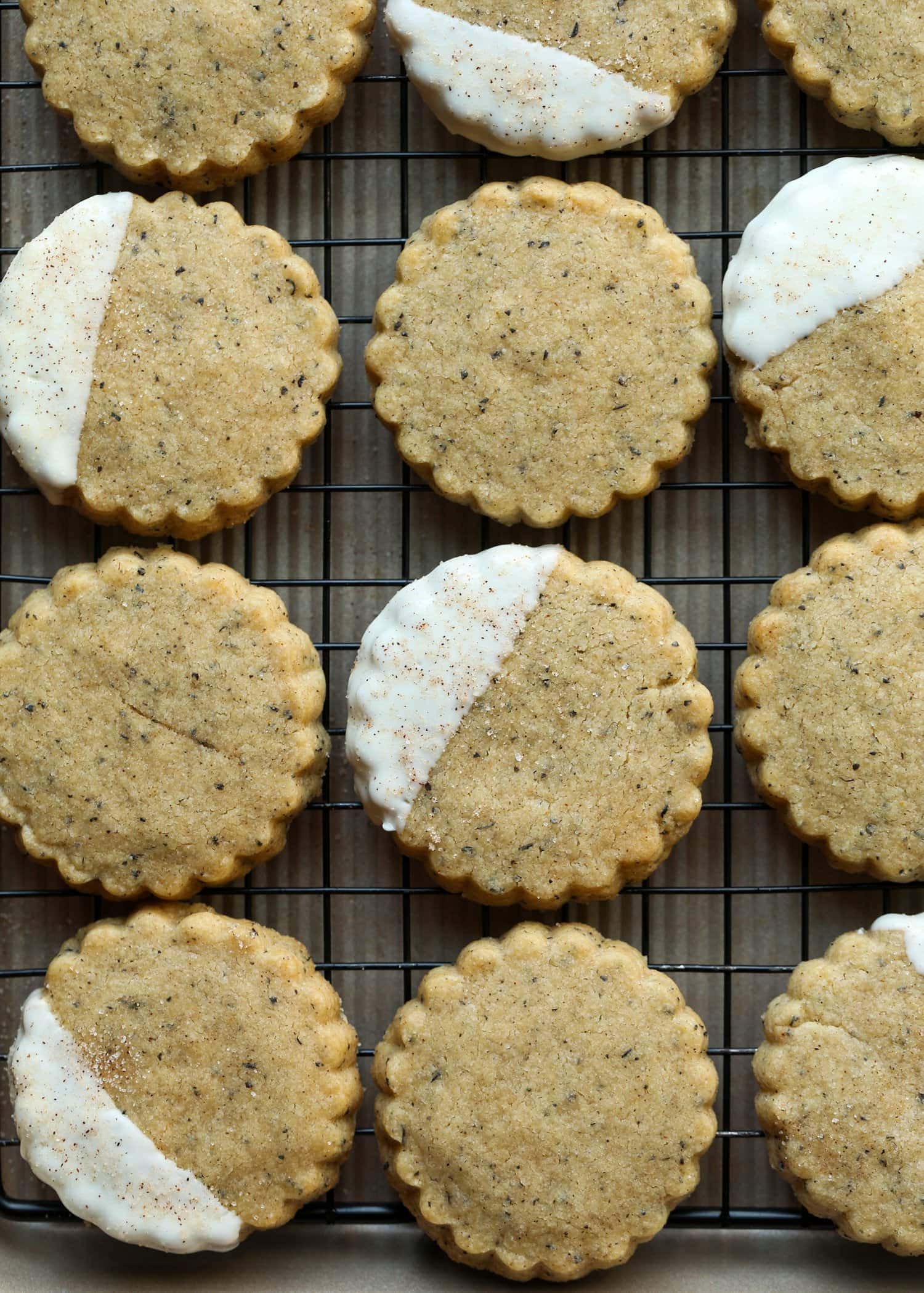 Chai Shortbread on a cooling rack half dipped in white chocolate