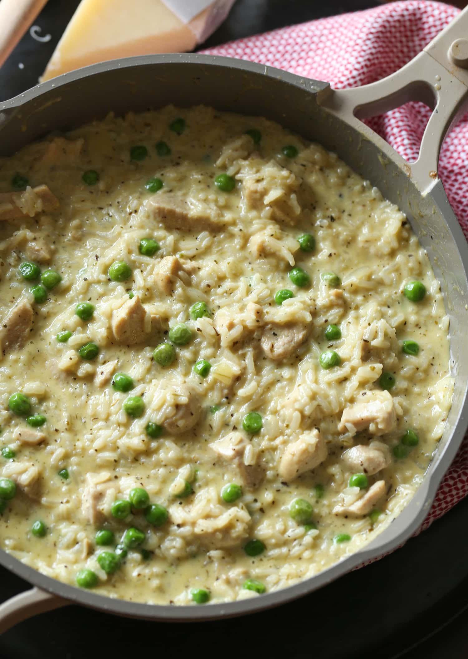 A pot of cooked creamy chicken and rice.