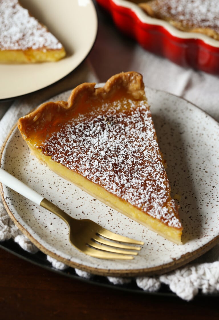 Slice of lemon chess pie on a plate