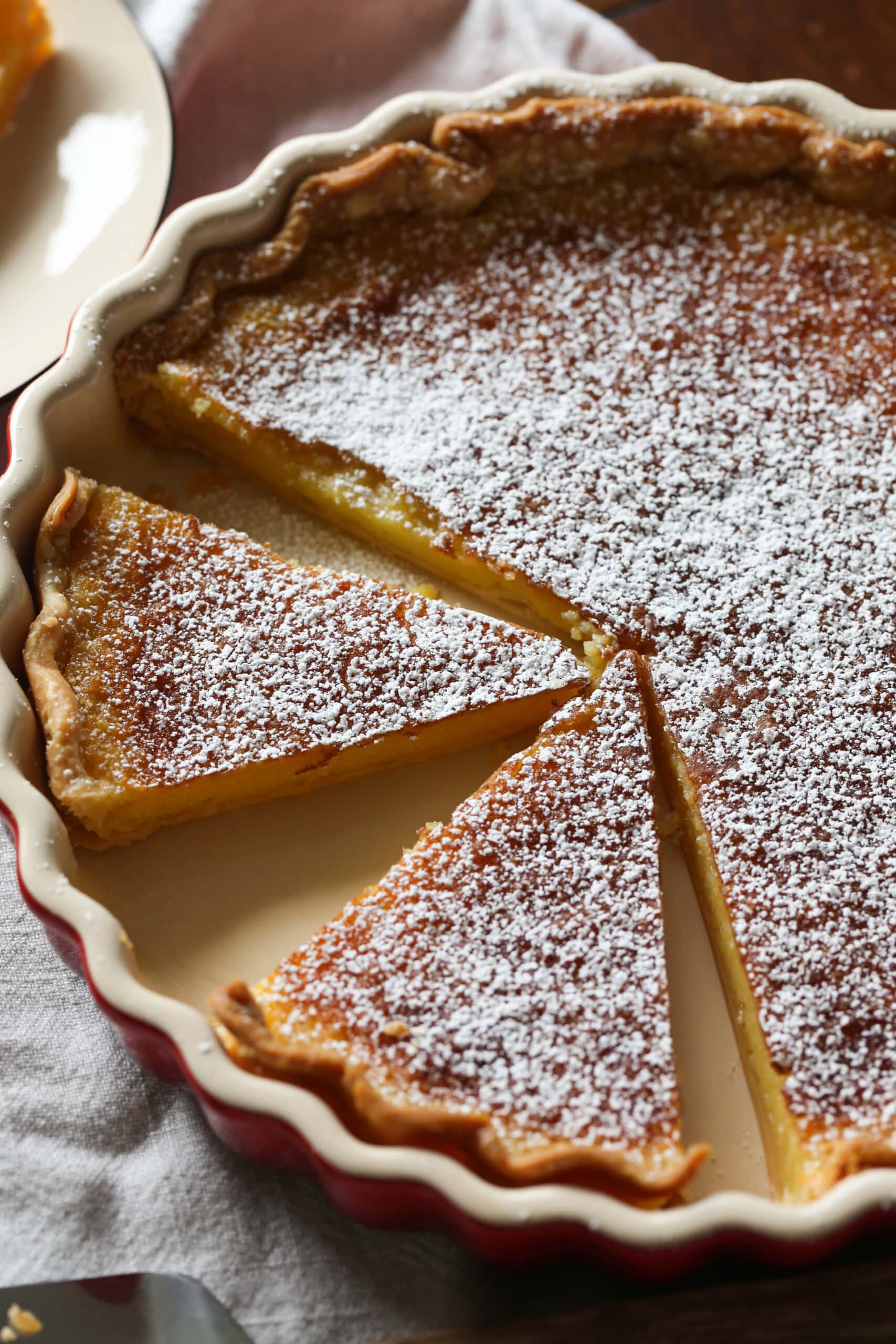 Lemon Chess Pie sliced in a pie pan