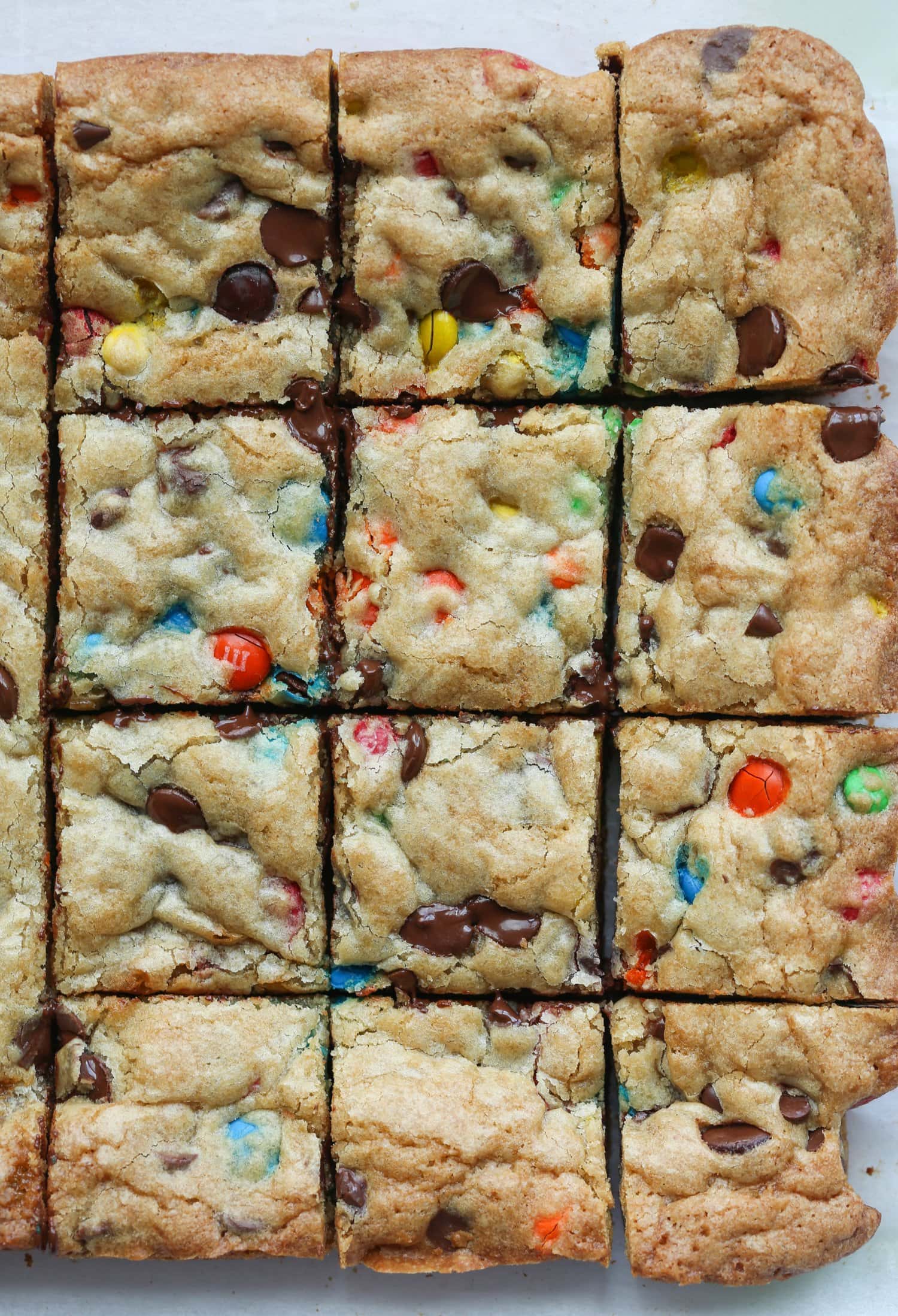 chocolate chip m&m cookie bars cut after being baked