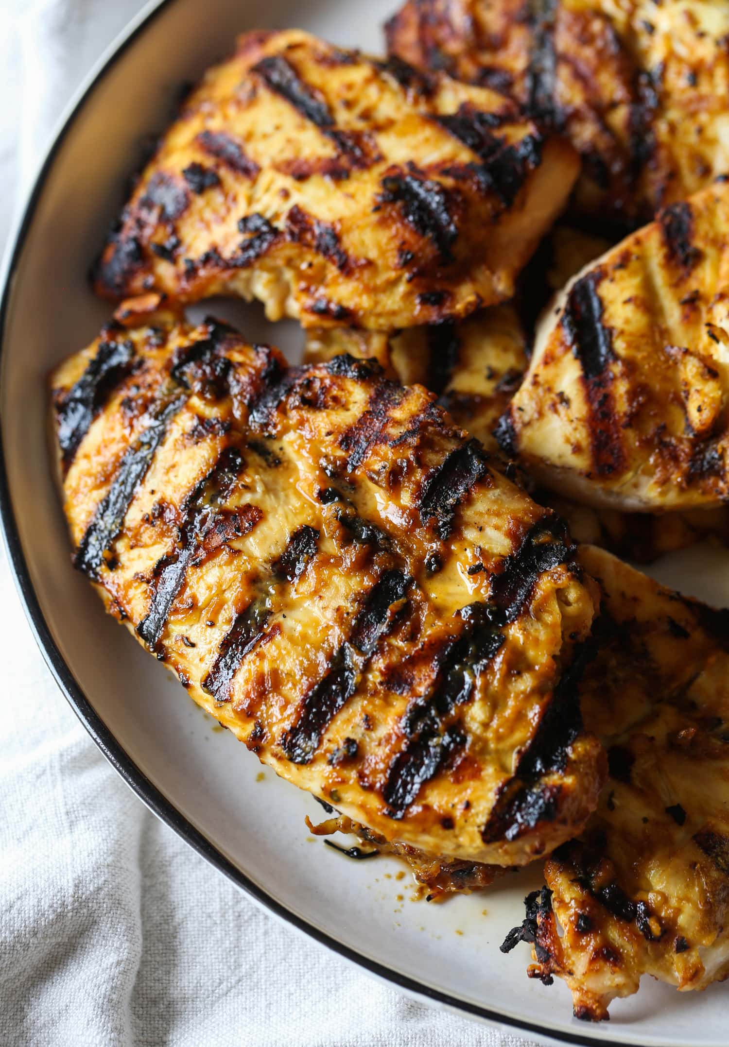 Grilled chicken coated in peanut sauce.