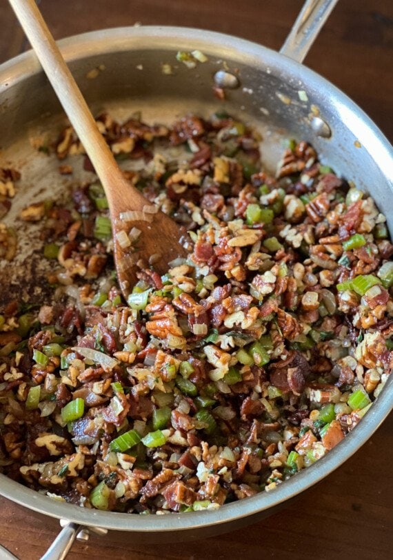 combination of bacon, onion, and celery in a skillet