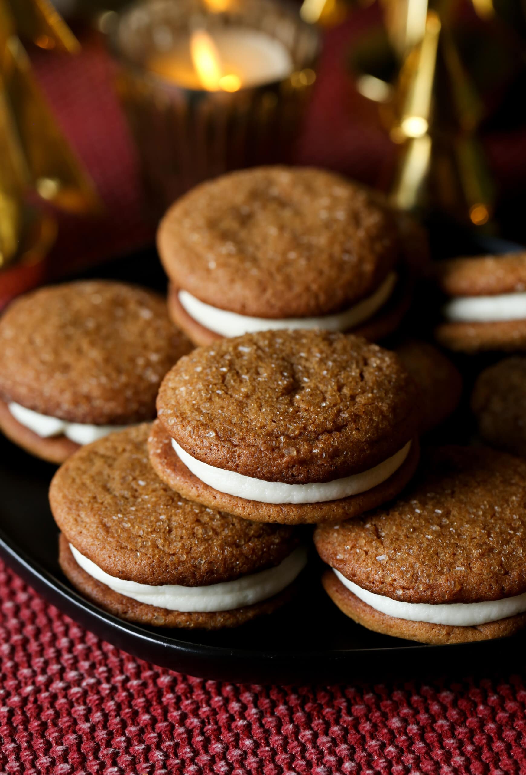 A pile of gingerbread sandwiches on a plate