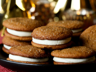 Soft Gingerbread Cookie Sandwiches on a plate with Christmas decor