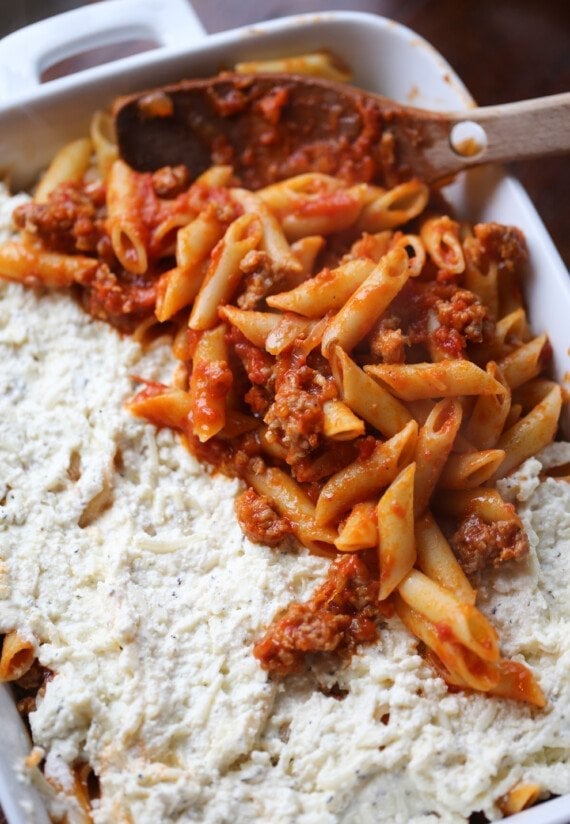 A pasta layer is added on top of the ricotta cheese layer.