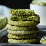 Matcha Shortbread cookies stacked with one broken in hlaf