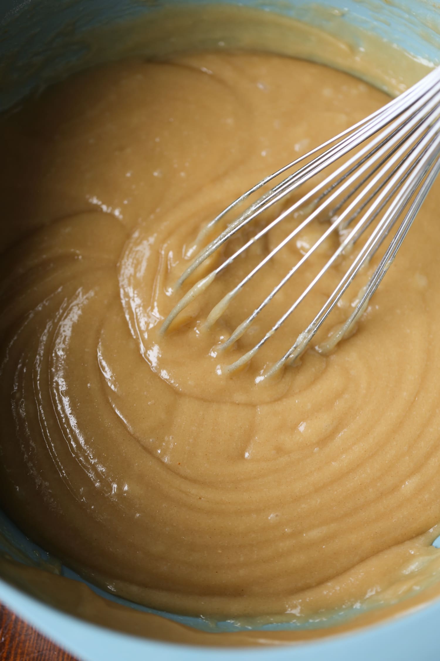 Peanut butter cake batter being whisked.