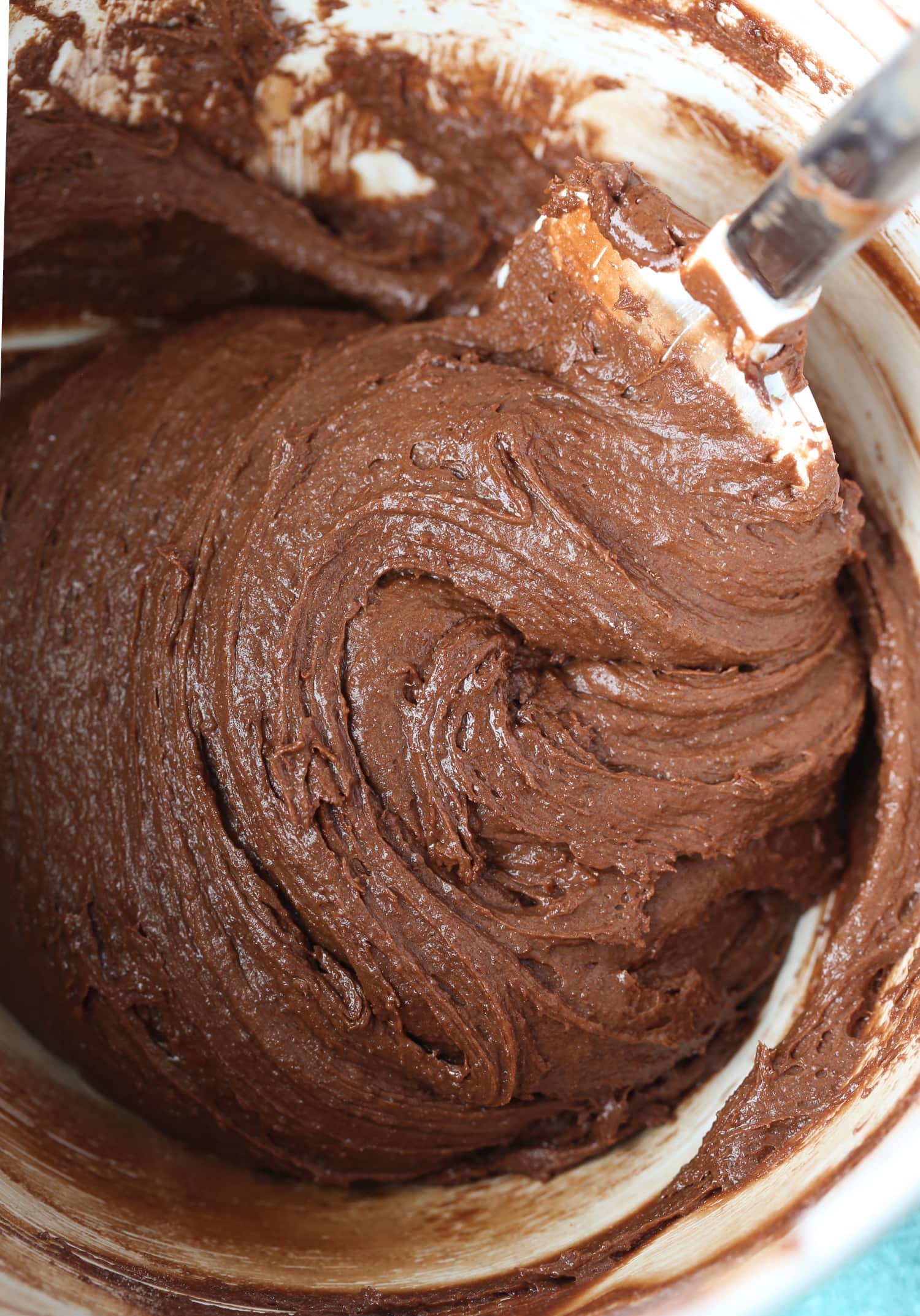 Chocolate cookie dough comes together in a mixing bowl.