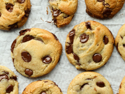 air fryer chocolate chip cookies on the air fryer rack with parchment paper