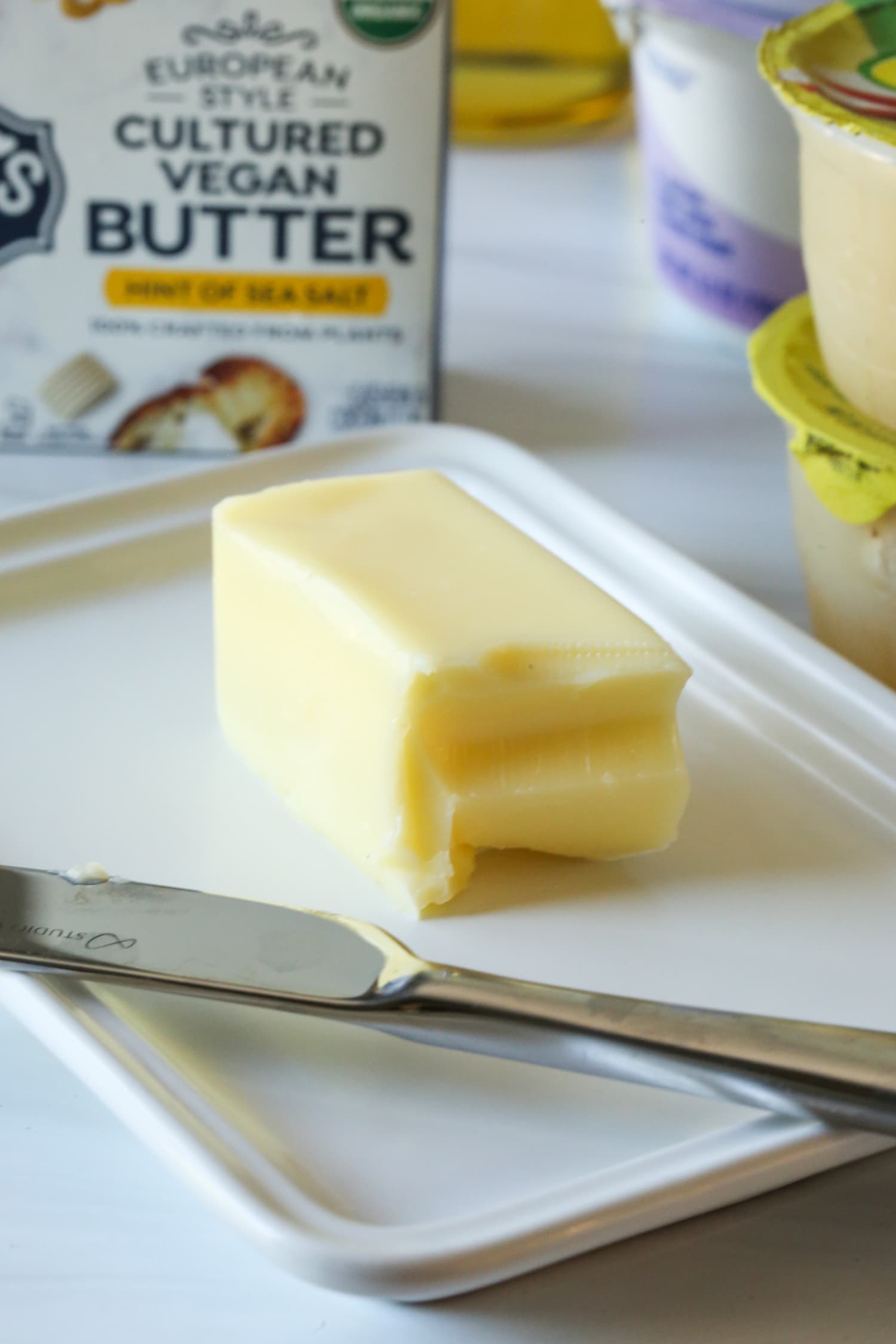 butter in a dish with a butter knife
