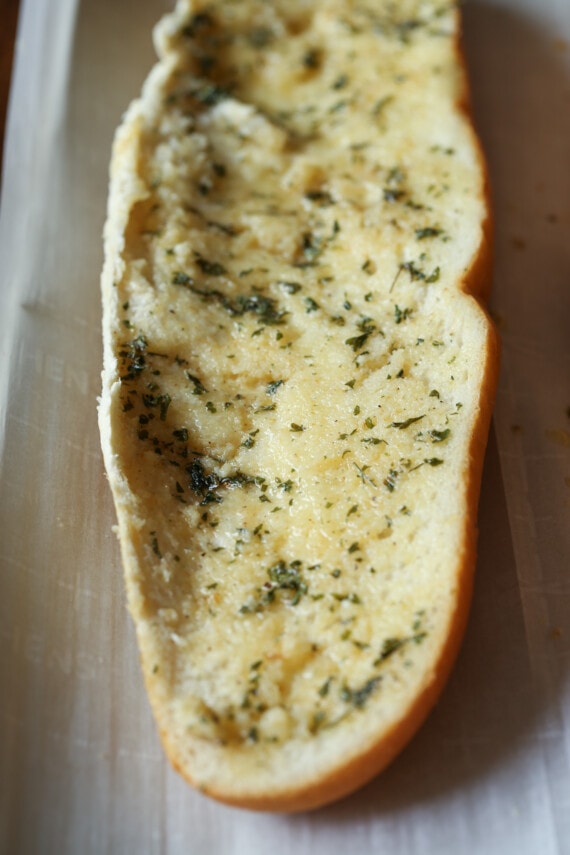 Half a French bread loaf brushed with garlic butter.
