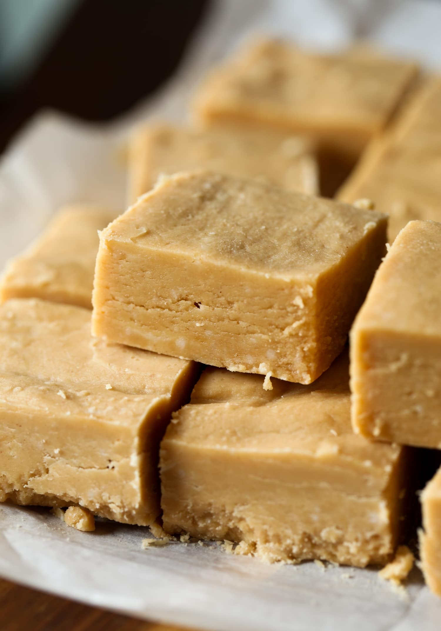 Stack of peanut butter fudge squares.