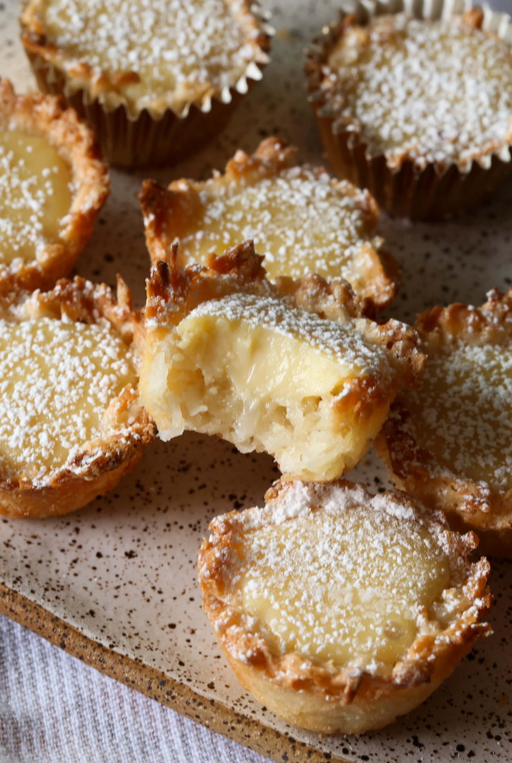 Lemon Coconut Tassies with a bite taken out