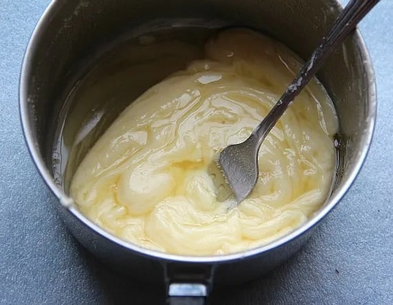 Melted white chocolate chips and butter in a saucepan