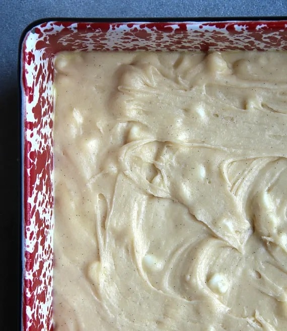 Overhead view of white chocolate brownie batter in a pan