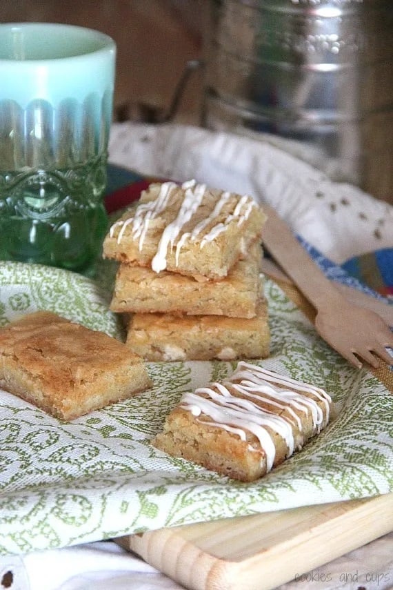 White chocolate brownies on a green and white napkin