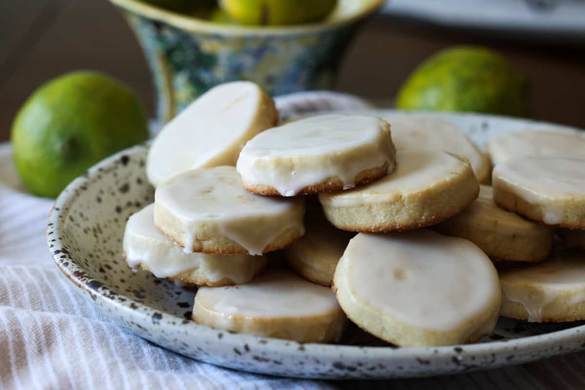 citrus shortbread covered in icing on a ceramic plate
