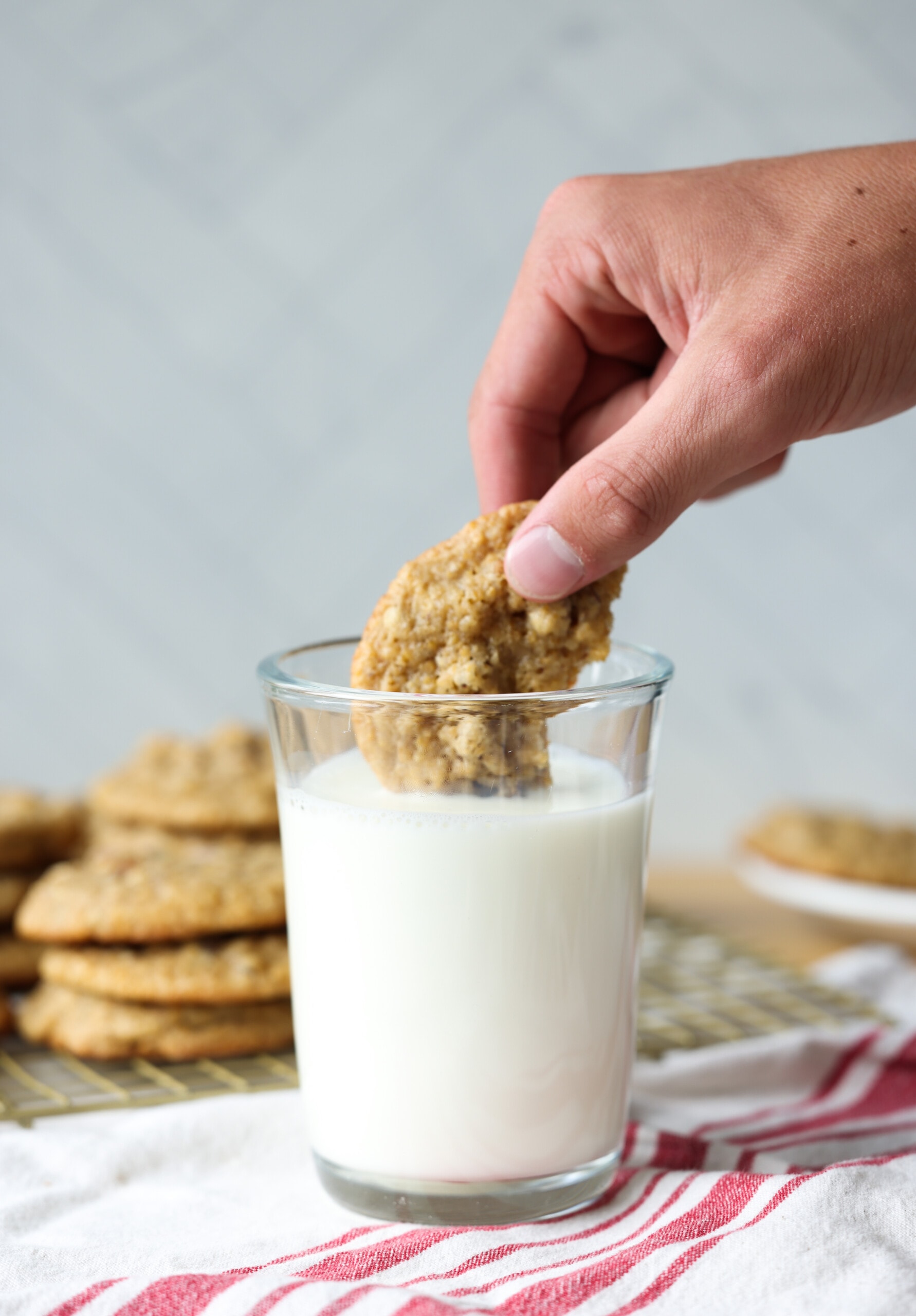 dunking a pecan cookie in milk