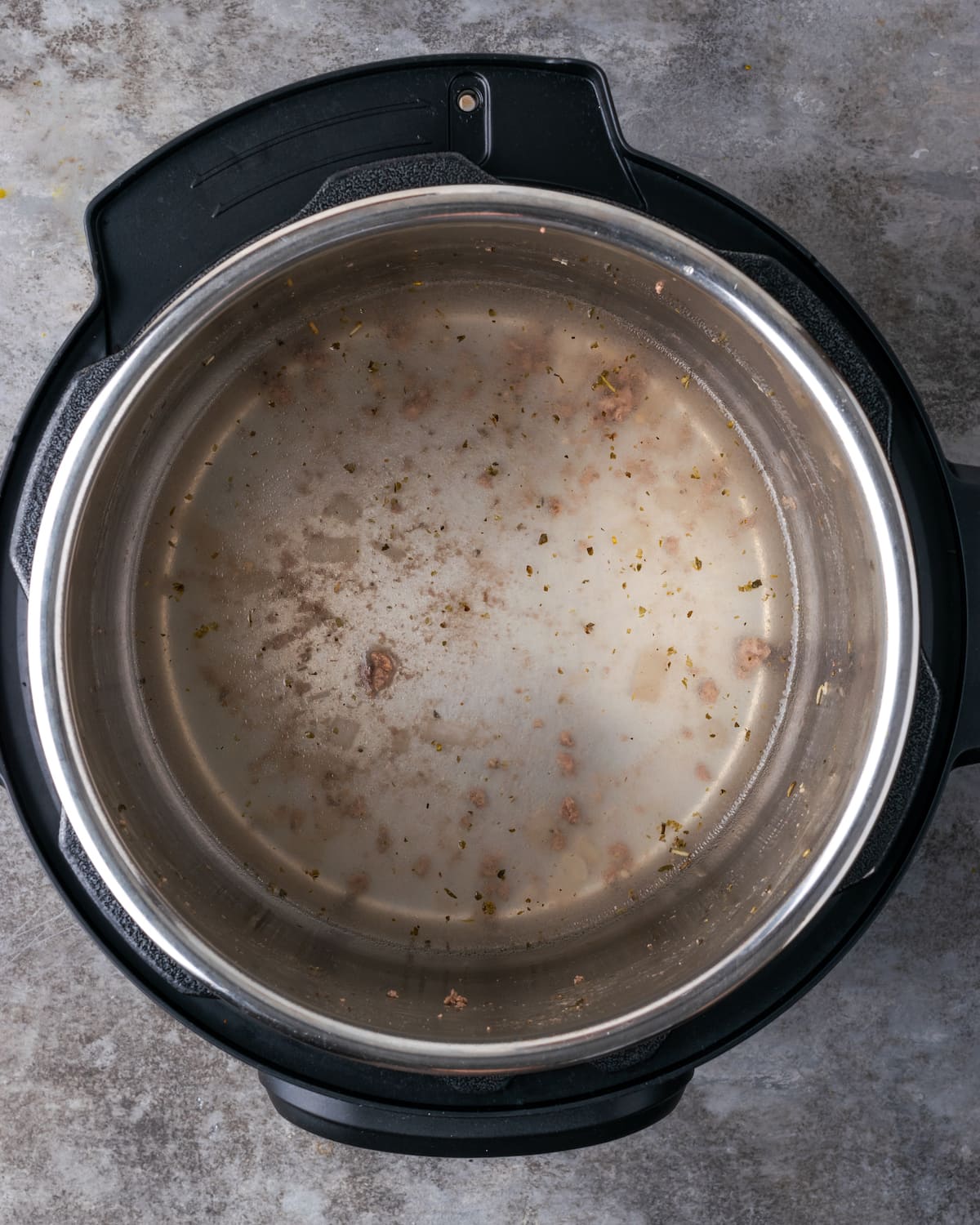 Overhead view of water inside the instant pot.