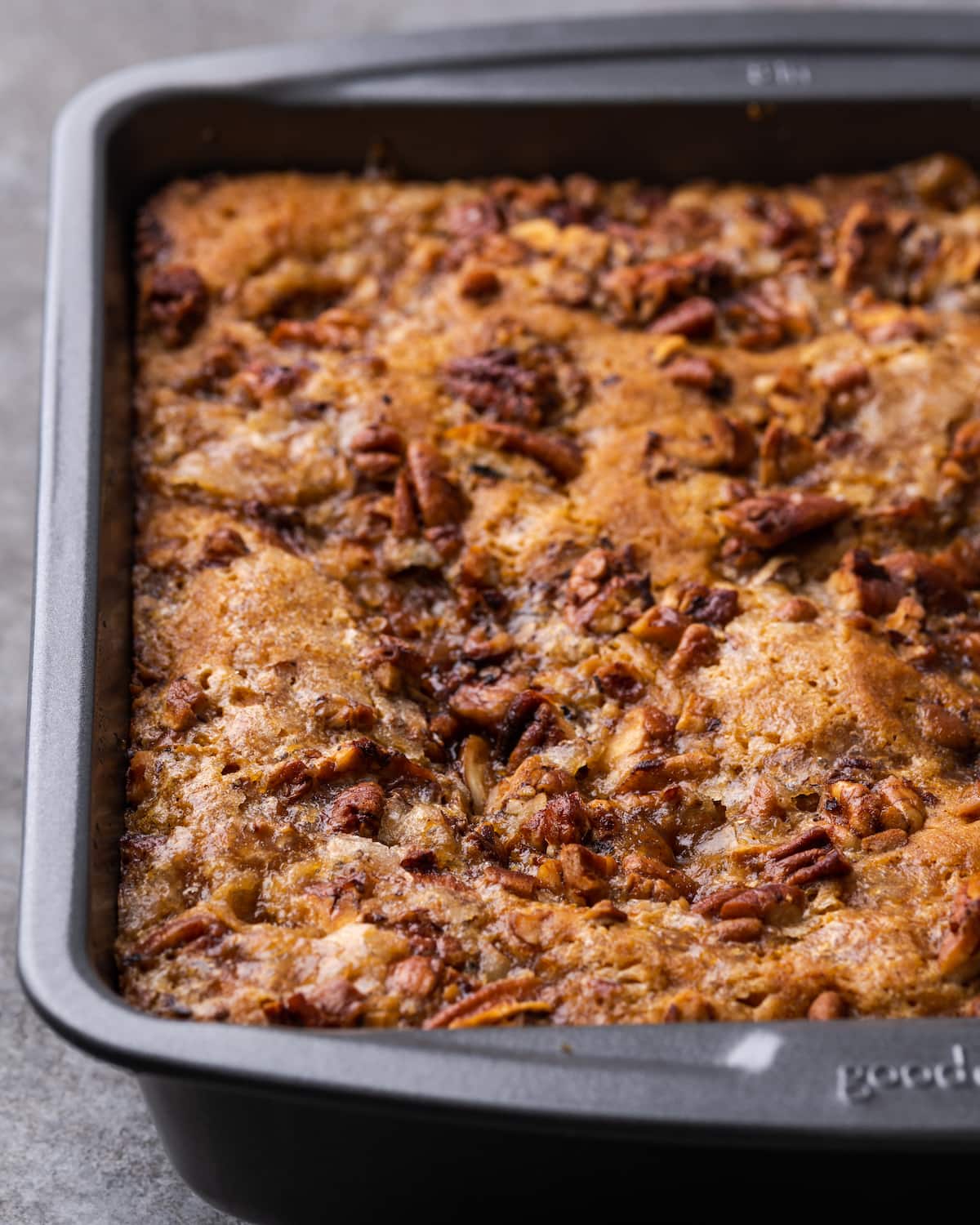 Pumpkin pecan cobbler in a metal baking pan.