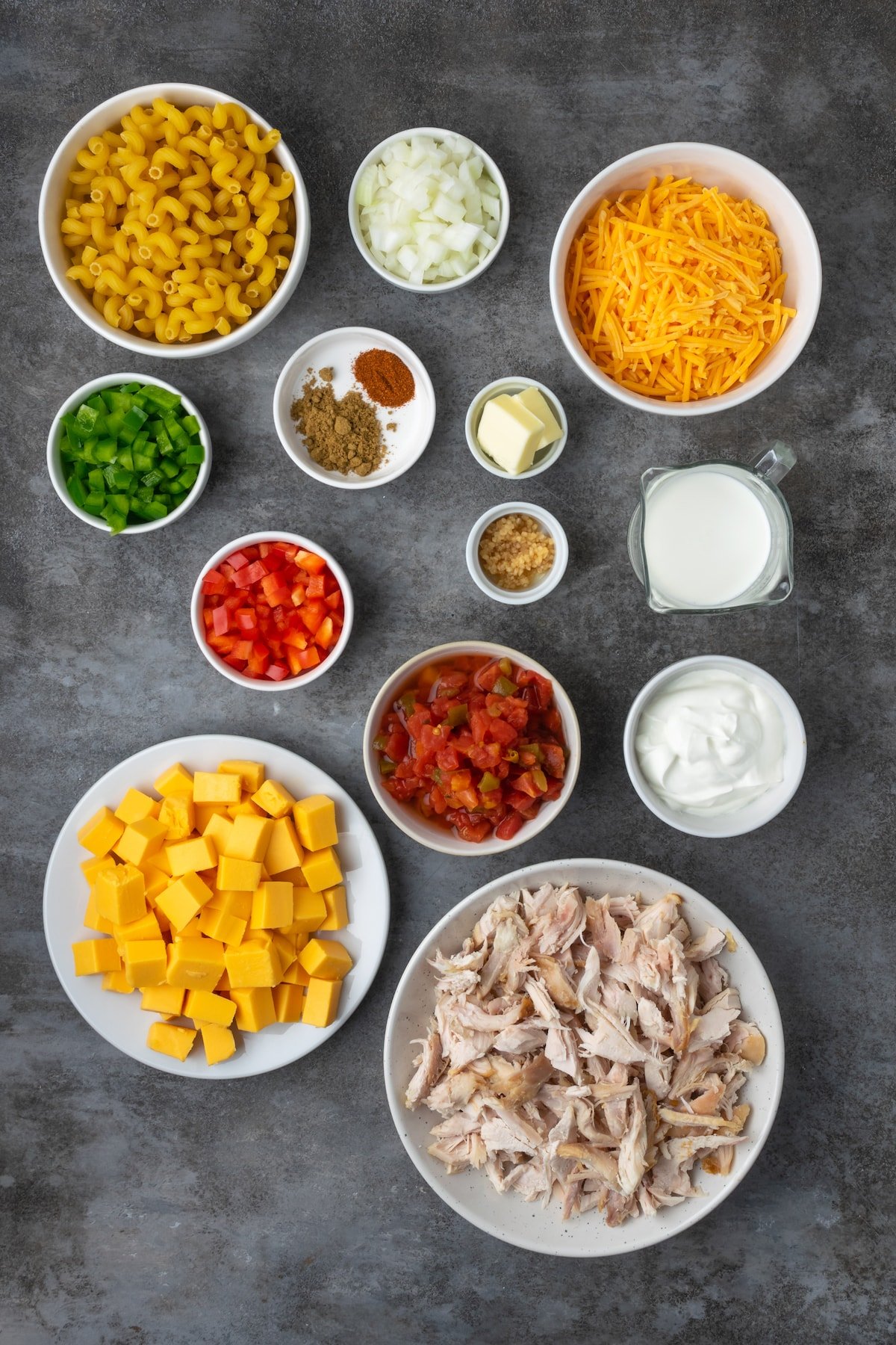 Ingredients for ranch mac and cheese in white bowls