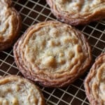 Large chewy walnut cookies on a wire cooling rack