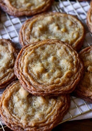 pan banging walnut cookies on a wire rack