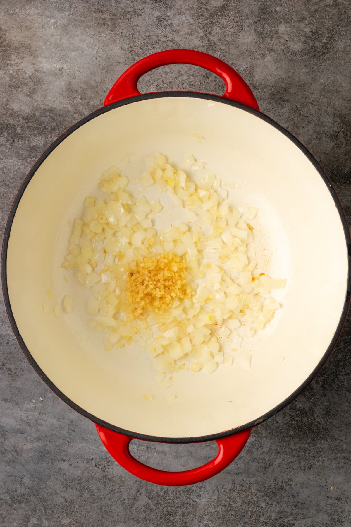 Diced onions and garlic in the bottom of a large pot.