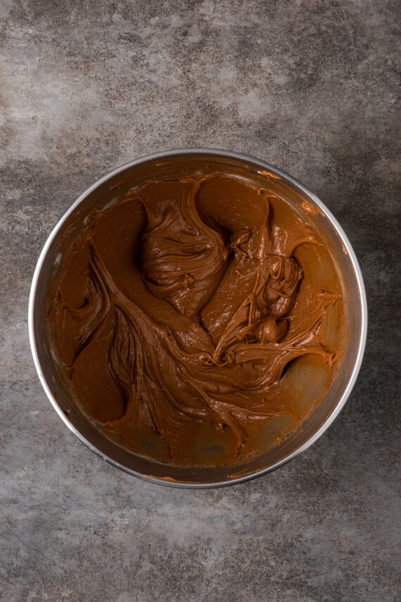 Nutella brownie dough in a metal mixing bowl.