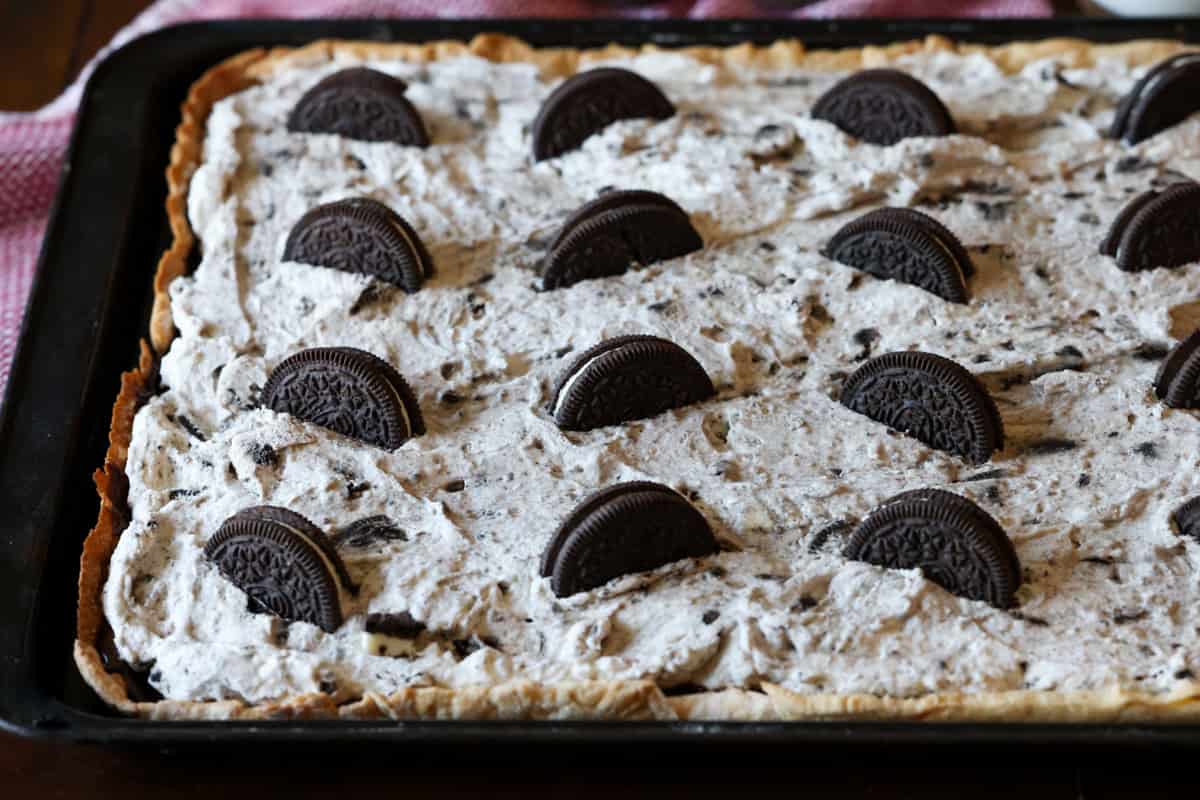 An Oreo pie baked in a sheet pan topped with Oreos