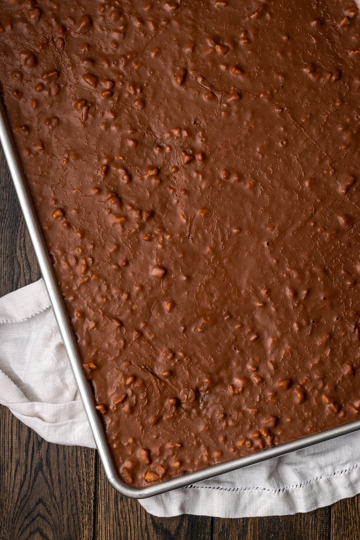 Overhead view of a Texas sheet cake covered in chocolate pecan icing.