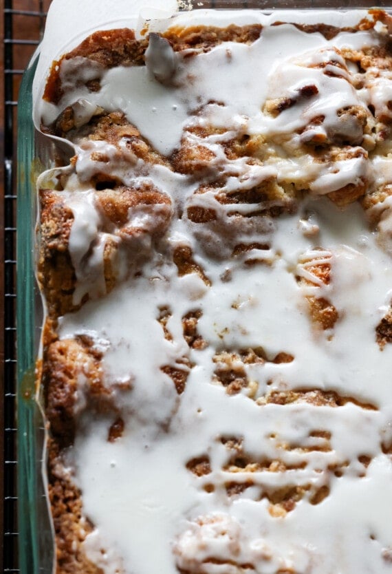 Cinnamon Roll Dump Cake baked with icing drizzled on top